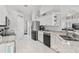 Well-appointed kitchen with stainless steel appliances, granite countertops and ample cabinet space at 5400 Saddleback Ct, Lady Lake, FL 32159
