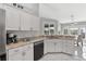 Spacious kitchen featuring stainless steel appliances, granite countertops and ample cabinet space and storage at 5400 Saddleback Ct, Lady Lake, FL 32159