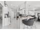 Bright kitchen features marble floors, white cabinets, granite countertops and stainless steel appliances at 5400 Saddleback Ct, Lady Lake, FL 32159