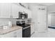 Modern kitchen featuring granite countertops, stainless steel appliances, and ample storage space at 5400 Saddleback Ct, Lady Lake, FL 32159