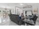 Open-concept living area with cozy seating, tasteful decor, and seamless flow into the dining space at 5400 Saddleback Ct, Lady Lake, FL 32159