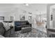 Spacious living area showing modern furnishings and an elegant area rug, with view to the dining area at 5400 Saddleback Ct, Lady Lake, FL 32159