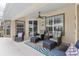 Comfortable seating arrangement with a ceiling fan, and a serene outdoor atmosphere at 5400 Saddleback Ct, Lady Lake, FL 32159