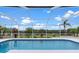 Enjoy the screened pool and expansive backyard views, ideal for outdoor living and relaxation at 5400 Saddleback Ct, Lady Lake, FL 32159