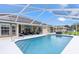 Sparkling screened-in pool with comfortable seating, and a serene outdoor atmosphere at 5400 Saddleback Ct, Lady Lake, FL 32159