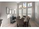 Dining room with a modern chandelier and views out the windows at 5604 Gulf Stream St, Tavares, FL 32778