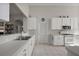 Bright kitchen featuring white cabinets and countertops, and modern appliances at 5604 Gulf Stream St, Tavares, FL 32778