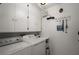 Functional laundry room with a washer and dryer, complemented by ample storage cabinets and hanging rack at 5604 Gulf Stream St, Tavares, FL 32778