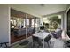 Enclosed patio with outdoor dining set, comfortable seating, and sliding glass doors leading inside at 5604 Gulf Stream St, Tavares, FL 32778