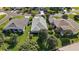 Beautiful backyard with mature landscaping, a lush green lawn, and a privacy hedge at 5604 Gulf Stream St, Tavares, FL 32778