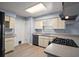 Well-equipped kitchen with modern gas range, ample counter space, and a bright window at 5618 Rosewall Cir, Leesburg, FL 34748