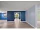 Spacious living room featuring new flooring and fresh paint, offering a modern feel at 5618 Rosewall Cir, Leesburg, FL 34748