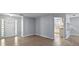 View of front entry door showcasing open layout and access to kitchen area with updated floors at 5618 Rosewall Cir, Leesburg, FL 34748
