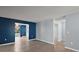Open-concept living area with updated flooring and neutral paint, perfect for entertaining at 5618 Rosewall Cir, Leesburg, FL 34748