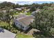 An aerial shot showcasing the rear view of this home with mature trees, landscaping and neighborhood views at 5618 Rosewall Cir, Leesburg, FL 34748