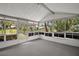 Covered and screened patio with views of the landscaped yard at 5618 Rosewall Cir, Leesburg, FL 34748