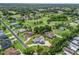 Spacious home with large driveway in a golf course community with mature trees and well-manicured lawns at 563 Dowling Cir, Lady Lake, FL 32159
