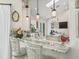 Bright kitchen featuring white cabinets, marble countertops, and pendant lighting fixtures at 563 Dowling Cir, Lady Lake, FL 32159