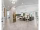 Bright living room featuring tile floors, neutral colors, and an open layout to the rest of the home at 563 Dowling Cir, Lady Lake, FL 32159