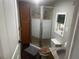 Cozy bathroom featuring a glass shower, wood cabinets, and a gray accent rug at 606 Hamilton Dr, Orlando, FL 32833