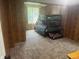 Bedroom featuring wood paneling, carpet and a bunk bed at 606 Hamilton Dr, Orlando, FL 32833