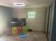 Shot of bedroom, neutral colored carpet, shiplap walls, black crib and modern ceiling fan at 606 Hamilton Dr, Orlando, FL 32833