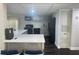 Modern kitchen boasts stainless steel appliances, ample counter space, and stylish gray cabinets at 606 Hamilton Dr, Orlando, FL 32833