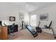 Well-lit exercise room with fitness machines, neutral carpet, and a ceiling fan at 627 Leeds Pl, The Villages, FL 32162