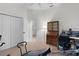 Spacious exercise room with fitness machines, neutral carpet, and closet for storage at 627 Leeds Pl, The Villages, FL 32162