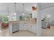 Open-concept kitchen with stainless steel appliances, pendant lighting, and easy access to the breakfast nook and living areas at 627 Leeds Pl, The Villages, FL 32162