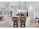 Open kitchen featuring counter seating, stainless steel appliances, and light countertops for a bright and airy feel at 627 Leeds Pl, The Villages, FL 32162