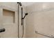 Shower stall featuring bronze fixtures, neutral tile and a built-in niche at 627 Leeds Pl, The Villages, FL 32162