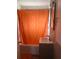 Bathroom featuring a tub with orange curtain, a sink, and a mirror at 640 Mansfield Rd, Tavares, FL 32778