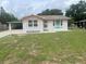 Charming single-story home with a well-maintained front yard and covered carport at 640 Mansfield Rd, Tavares, FL 32778