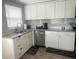 Newly remodeled kitchen features granite countertops, stainless appliances and tiled backsplash at 640 Mansfield Rd, Tavares, FL 32778