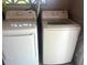Modern, matching white washer and dryer, placed side-by-side in a laundry room setting at 640 Mansfield Rd, Tavares, FL 32778