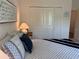 Bedroom featuring queen size bed with nightstand and wall art at 680 Joseph Way, The Villages, FL 34762