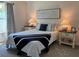 Comfortable bedroom featuring a queen-sized bed with decorative pillows and bedside tables at 680 Joseph Way, The Villages, FL 34762