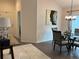 Dining room offers view into other living spaces, providing a flow between rooms at 680 Joseph Way, The Villages, FL 34762
