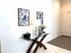Entryway with a decorative table and artwork on the wall at 680 Joseph Way, The Villages, FL 34762