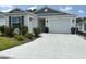 Charming single-story home with a well-manicured lawn and two-car garage, providing great curb appeal at 680 Joseph Way, The Villages, FL 34762