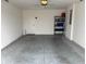 Spacious garage with finished floor and ample storage space for vehicles and household items at 680 Joseph Way, The Villages, FL 34762