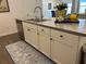 Kitchen island with stainless steel appliances, sink, and ample storage at 680 Joseph Way, The Villages, FL 34762