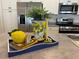 Kitchen countertop decorated with lemon-themed decor at 680 Joseph Way, The Villages, FL 34762