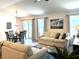 Bright living area with dining table and comfortable seating, creating an inviting space at 680 Joseph Way, The Villages, FL 34762