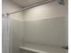 Shower with white subway tiles and a built-in bench at 680 Joseph Way, The Villages, FL 34762