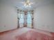 Bedroom featuring a ceiling fan and a window at 712 Old Oaks Ln, Leesburg, FL 34748