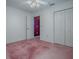 Bedroom featuring a ceiling fan and closet at 712 Old Oaks Ln, Leesburg, FL 34748