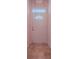 Clean foyer with a white door, tiled floor, and neutral walls at 712 Old Oaks Ln, Leesburg, FL 34748