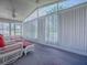 Enclosed lanai with furniture and great natural light at 712 Old Oaks Ln, Leesburg, FL 34748